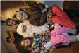 Family of Four Pose with Santa
