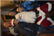 Family of Four Take a Picture with Santa
