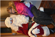 Girl in Pink Coat with Santa 2