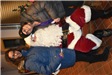 Mother and Daughter Take a Picture with Santa