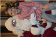 Young Boy in a Pink Button up on Santa's Lap