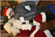 Boy in a Grey Coat Sitting on Santa's Lap