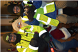 CERT Members in Fluorescent Vests with Santa