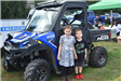 Two Kids Next to an Aberdeen Police 4-Wheeler