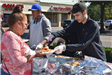 Woman Being Served a Burger