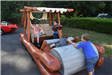 Young Boys play on a Flintstones Themed Car 1