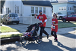 5K Runners Jogging with Their Kid in a Stroller