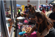 People Lined up at a Refreshments Table