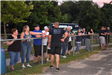 Spectators Line the Fence