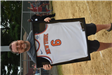 Man holding a Framed Basketball Jersey