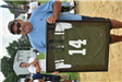 Man holding a Framed Soccer Polo