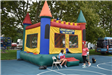 Volunteers Oversee the Bounce House