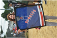 Woman Holding a Framed Rangers Jersey
