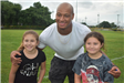 Athlete Has His Photo Taken with Two Young Girls