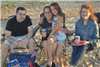 Family Pose for a Photo on the Beach