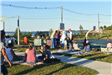 People Overlooking the Ocean from a Picnic Area