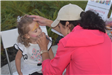 Young Girl Having Her Face Painted 2