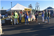 A Small Line Forming in Front of a Concessions Tent