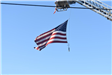 American Flag Seen Hanging from a Crane 1