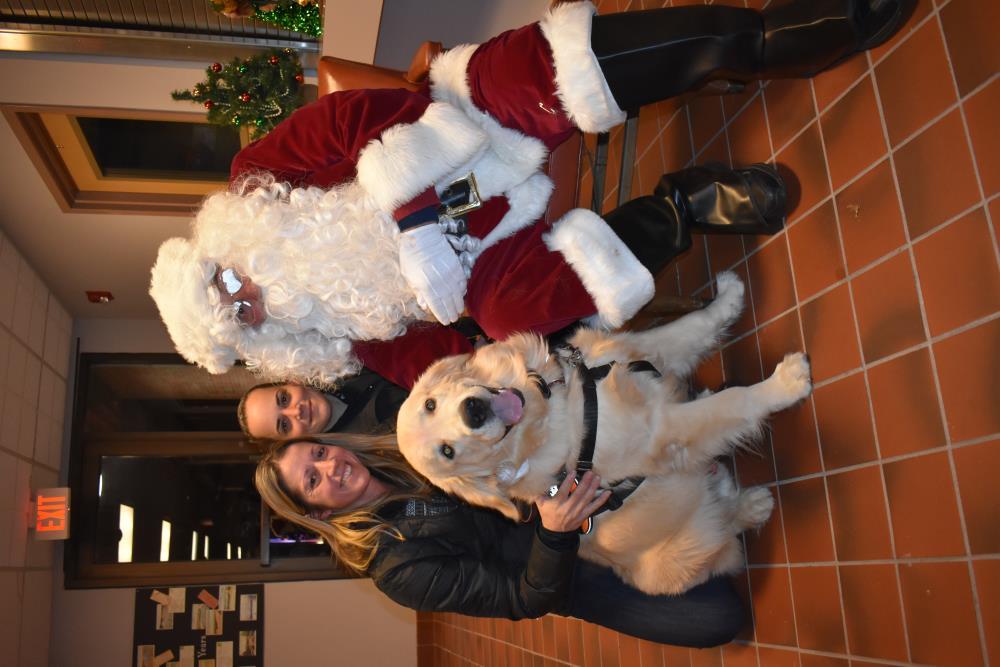 Two Women and a Golden Retriever with Take a Picture with Santa 1
