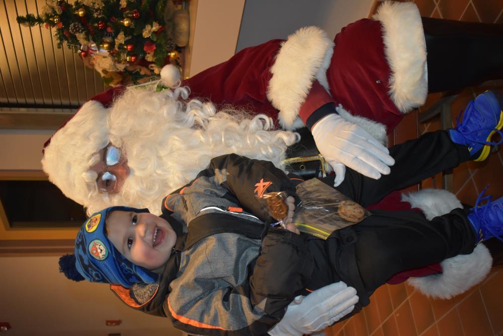 Young Boy in a Paw Patrol Hat with Santa