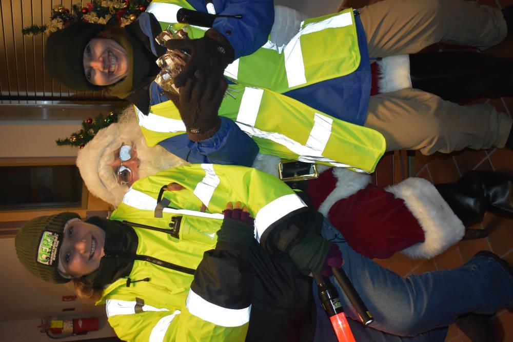CERT Members in Fluorescent Vests with Santa