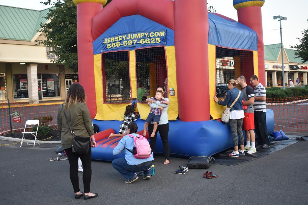 Parents Supervise Their Kids Inside an Inflatable Jump House