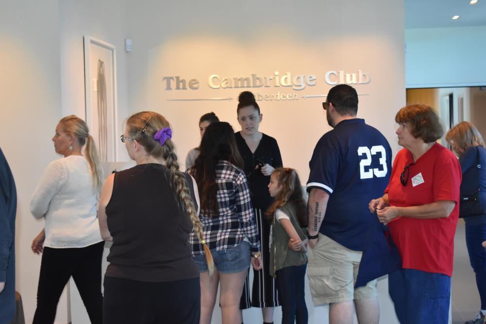 People Walking About the Cambridge Club