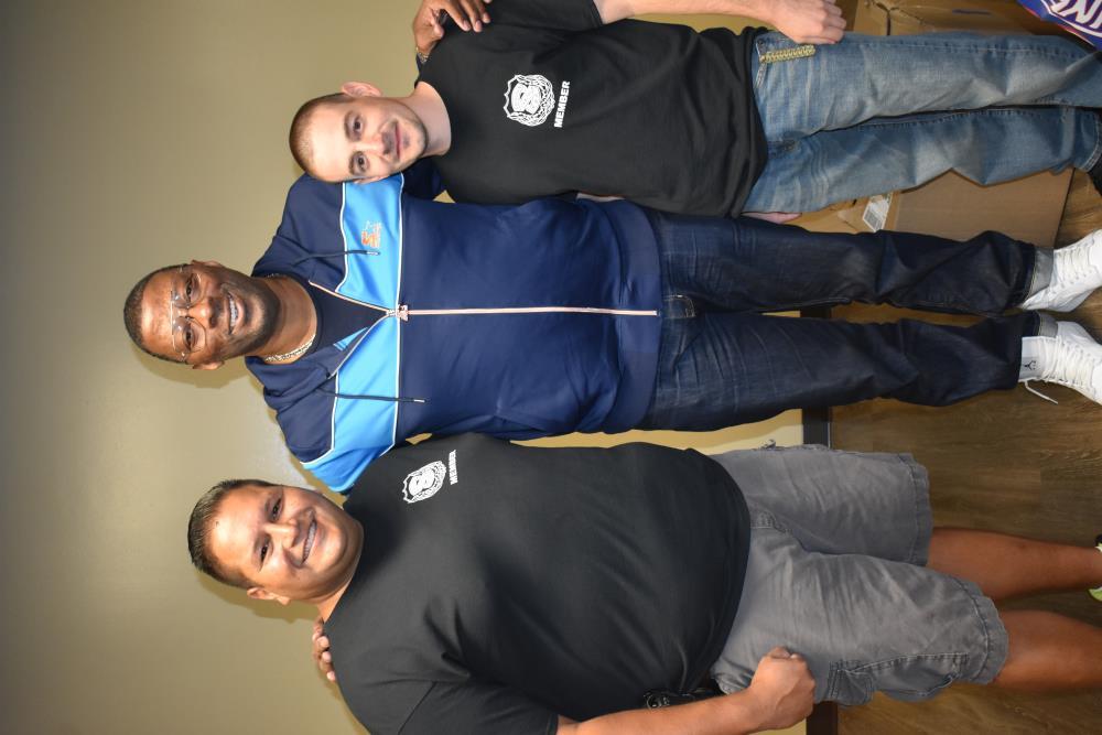 Police Officers Pose of a Photo with a Sports Star
