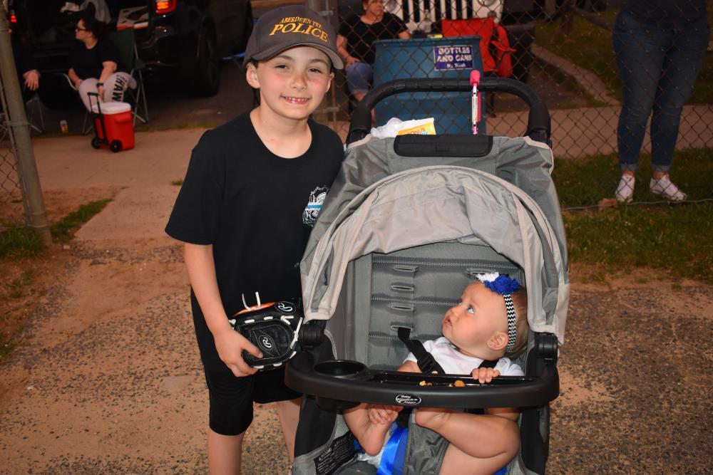 Young Boy and a Baby in a Stroller 1
