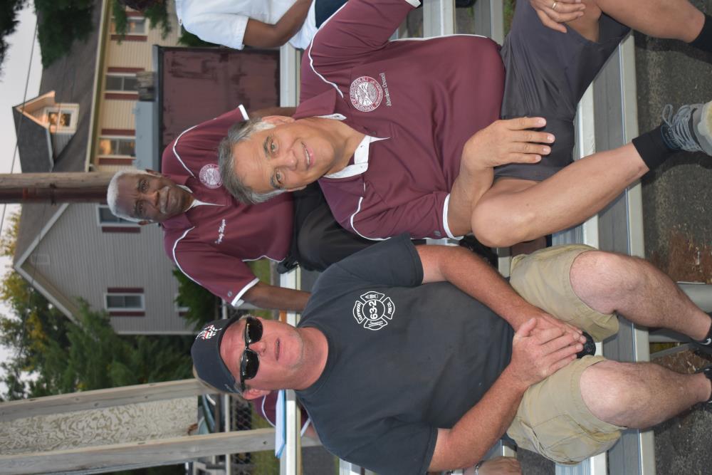 Mayor and Fire Chief Sit Together Watching the Game