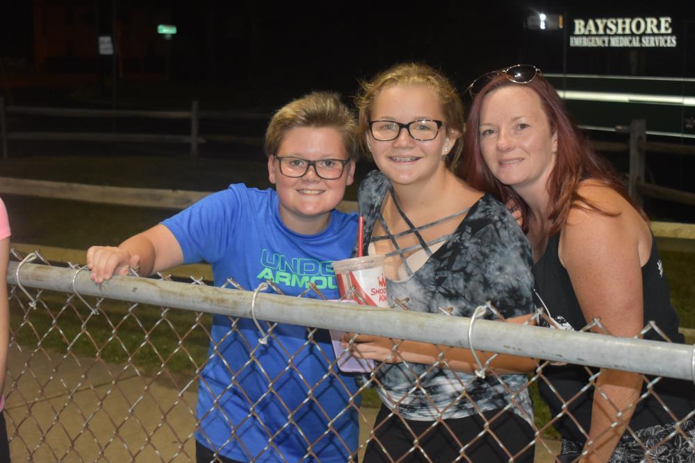 Mom and Her Kids Smile for the Camera