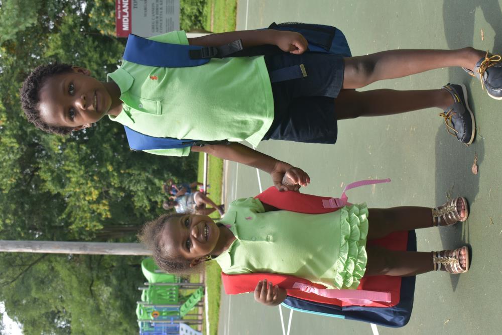 Two Kids with Their New Backpacks