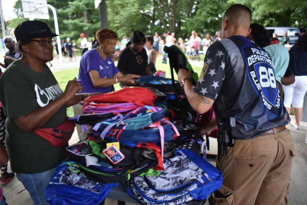 Volunteers at the Backpack Table