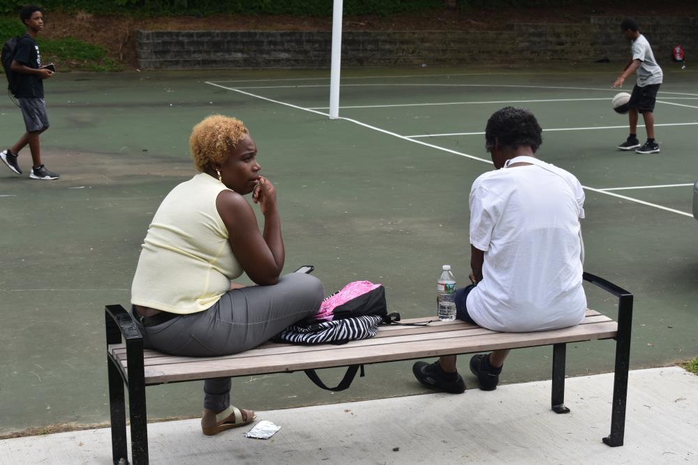 Event Attendees Sitting on a Bench