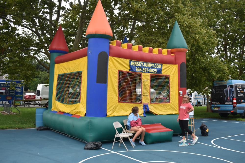Volunteers Oversee the Bounce House