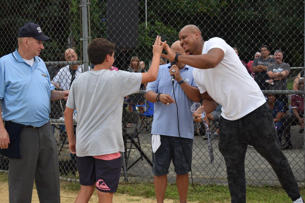 Athlete High Fiving a Boy