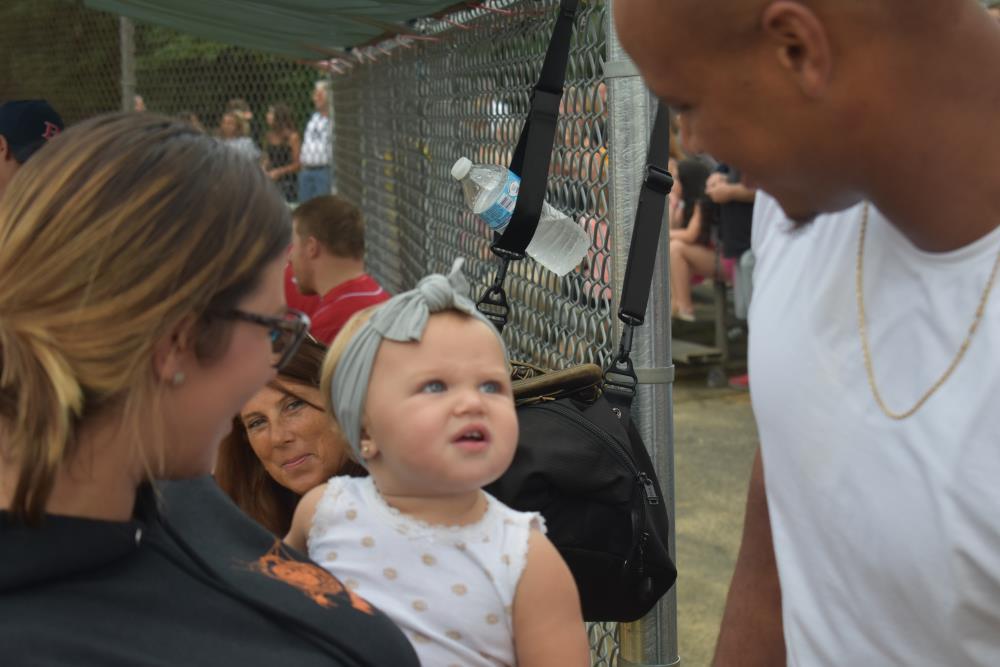 Baby Making a Strange Face at an Athlete
