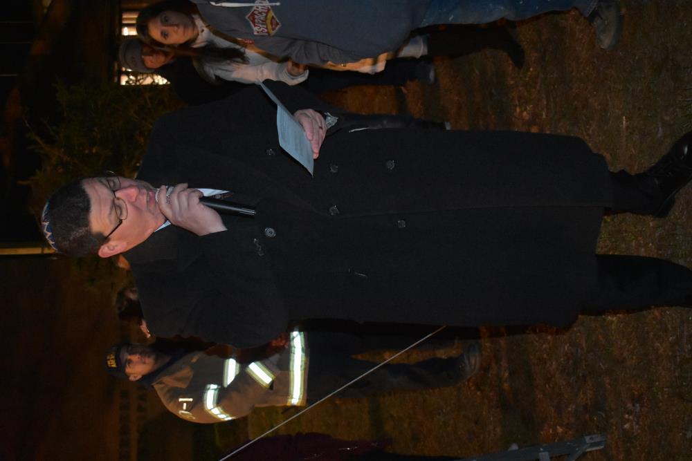 Rabbi Reading from a Program