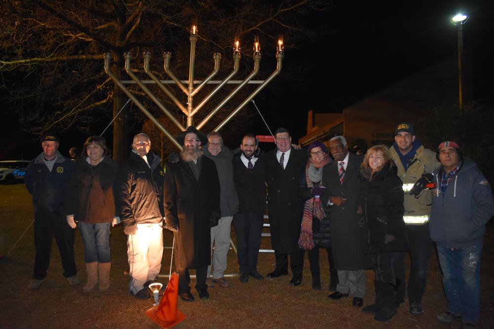 Special Guest Take a Picture in Front of the Town Menorah