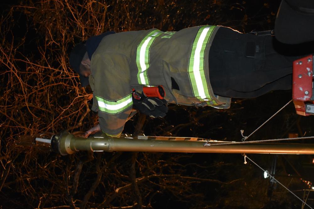 Fire Fighter Lights a Candle