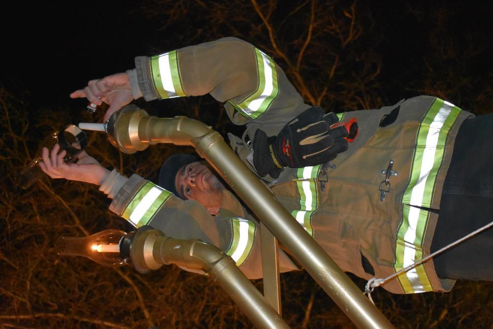 Fire Fighter Lights the Far-Right Candle